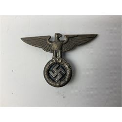 Three WW2 German visor cap badges comprising Police eagle, Political leaders eagle and Norwegian Quisling Party; all with fixings; and WW2 Polish visor cap badge (4)