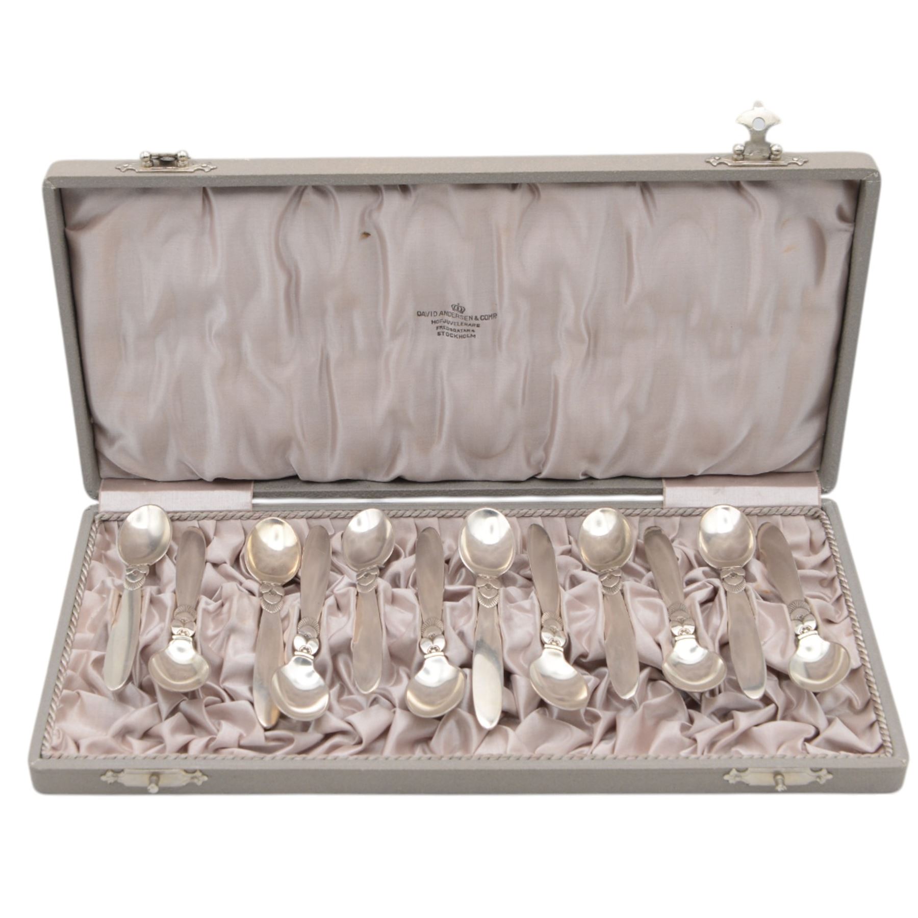 Set of twelve early 20th century Danish silver Cactus pattern demitasse spoons by Georg Jensen, marked for Georg Jensen, Denmark, also marked with Swedish national control mark and S standard mark for minimum 800 standard silver, contained within tooled leather David Andersen case with silk interior