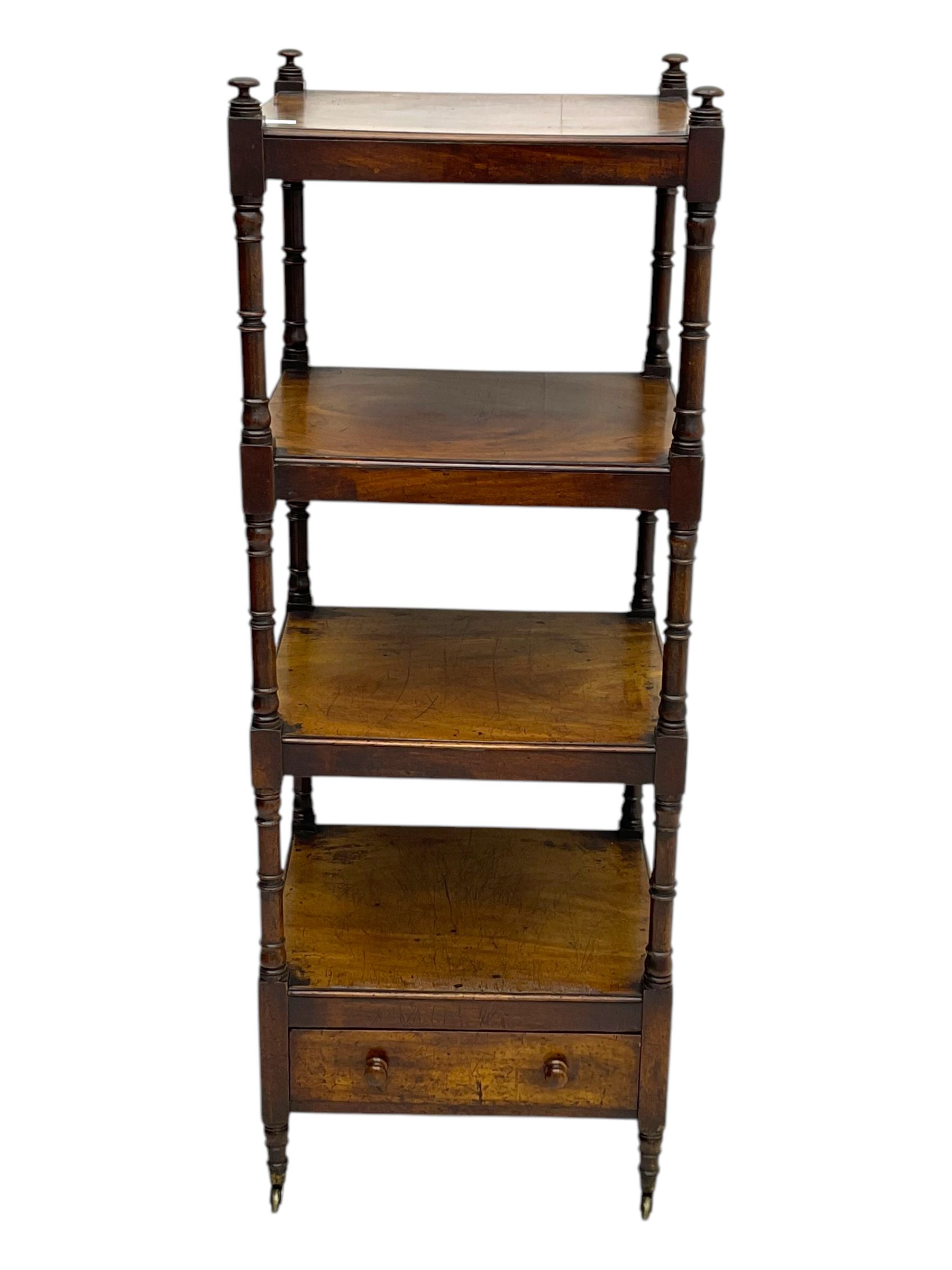 Early 19th century mahogany whatnot, with four rectangular shelves, the lower shelf fitted with a single drawer, supported by slender turned columns, raised on turned supports with brass castors