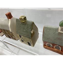 Twenty studio pottery figures of houses and cottages, comprising seventeen Mudlen End Studio Felsham Suffolk examples and two John Putman's Heritage Houses examples