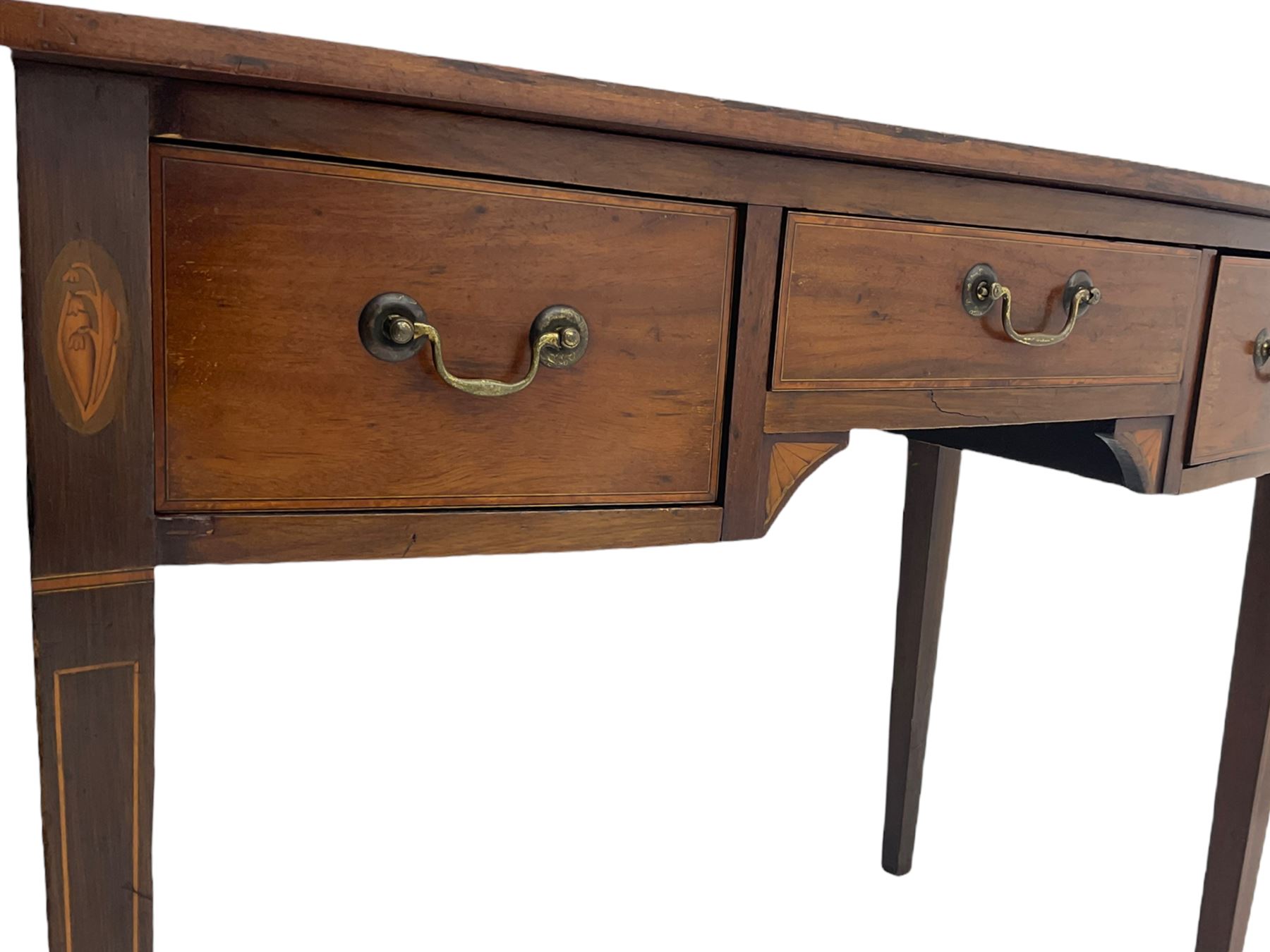 Edwardian mahogany dressing side table, raised back on bow front top with satinwood band, fitted with three drawers, inlaid with shell and fan motifs, square tapering supports