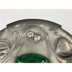 Liberty & Co Tudric pewter Bollelin tray, designed by Archibald Knox, of circular form with shaped edge, cast in relief with foliate tendrils surrounding a green enamel cartouche, impressed beneath Made by Library & Co English Pewter 044, D25.5cm