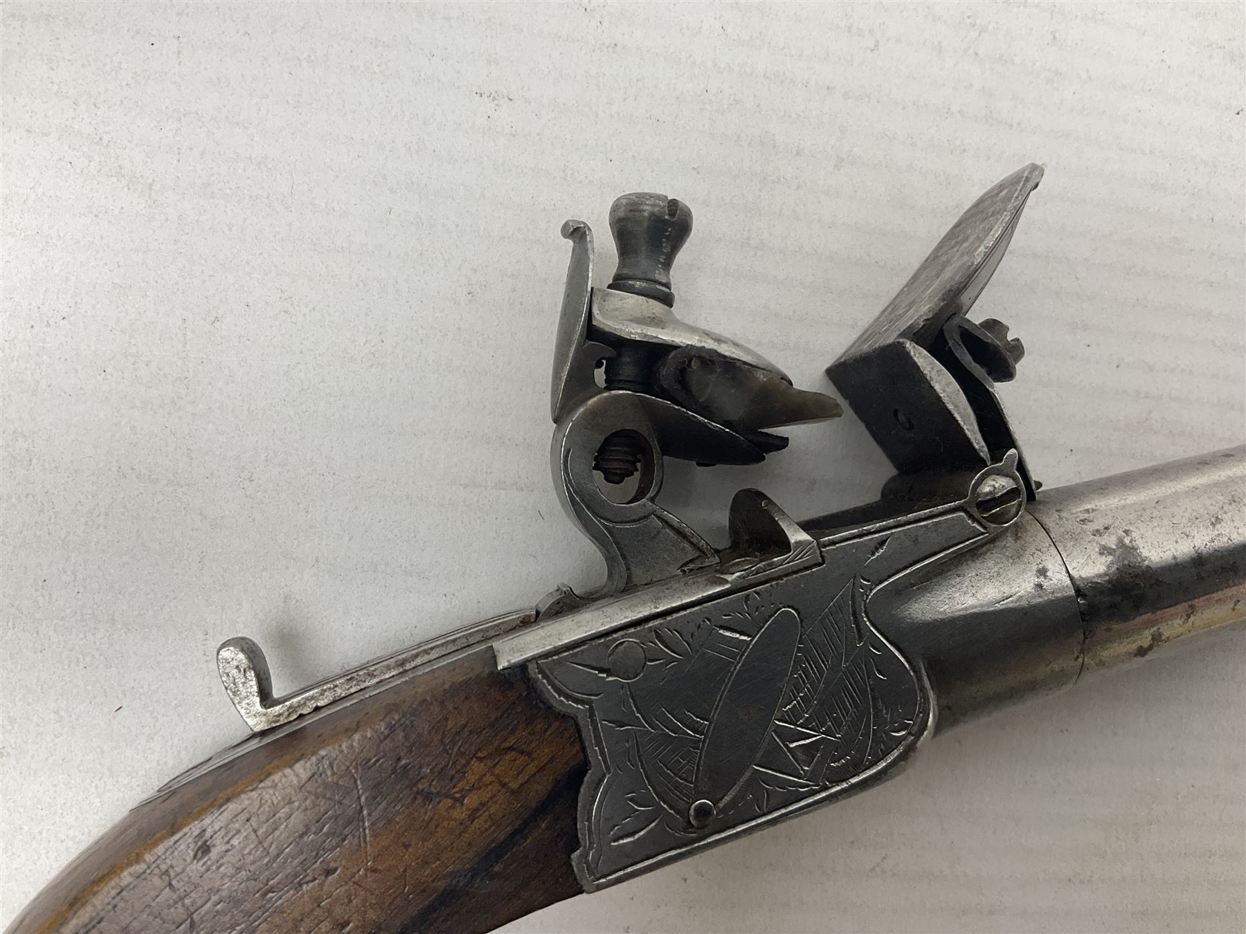 Early 19th century J. Calvert (Leeds) flintlock single barrel tap action pocket pistol, approximately .45 cal., the 4cm (originally) screw off barrel with top safety and walnut stock L16cm overall