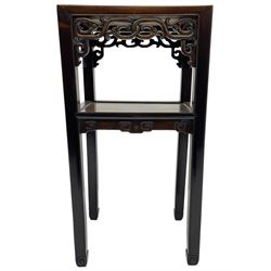 Early 20th century Chinese hardwood and marble jardinière or urn stand, rectangular form with red variegated marble inset over under tier, mounted with pierced and carved frieze rails and brackets, scroll carved support terminals