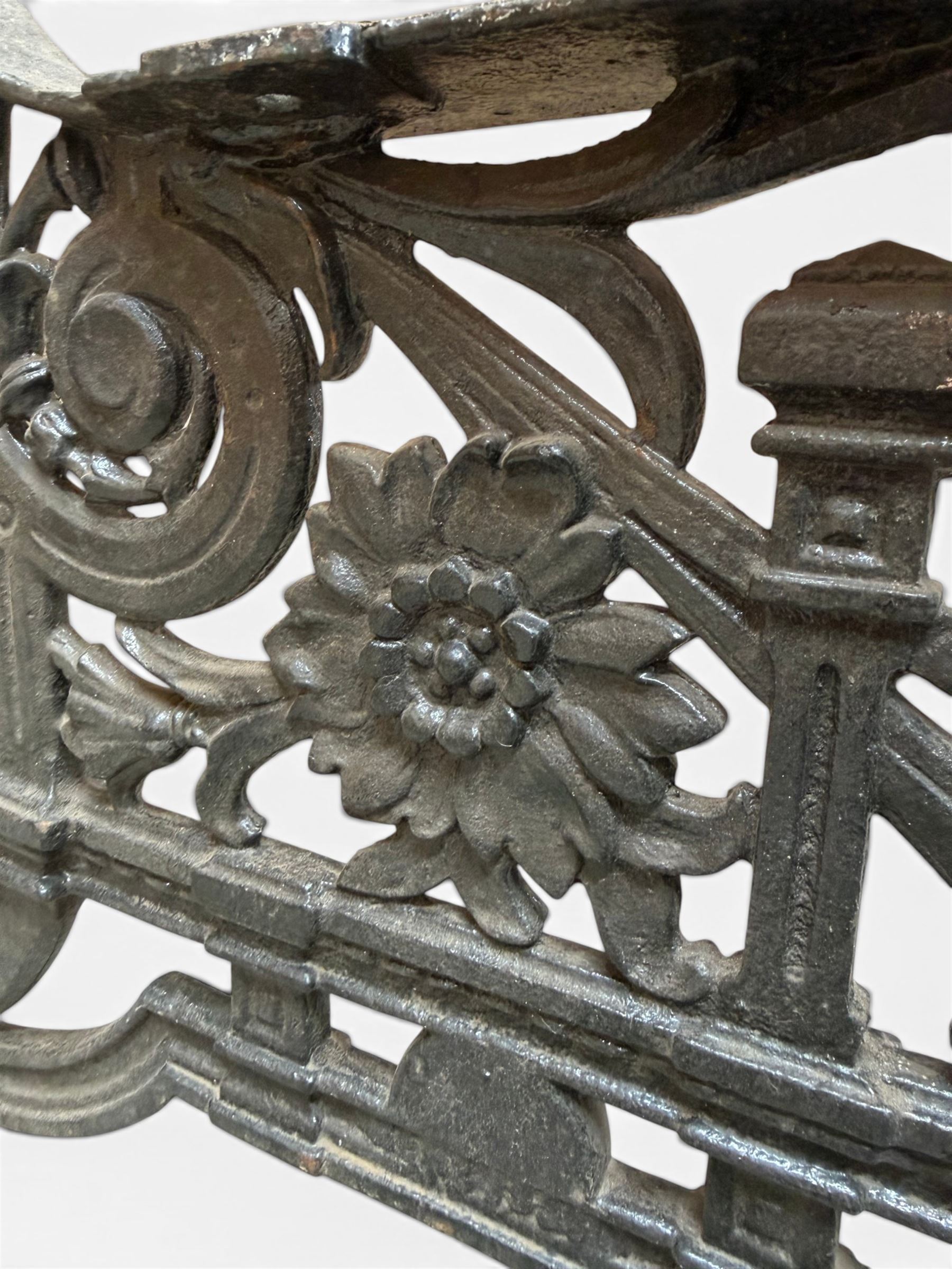 Yates Haywood - pair of Victorian cast iron bench ends, Architectural scrolling design with flower head detail, stamped with period registration number and date