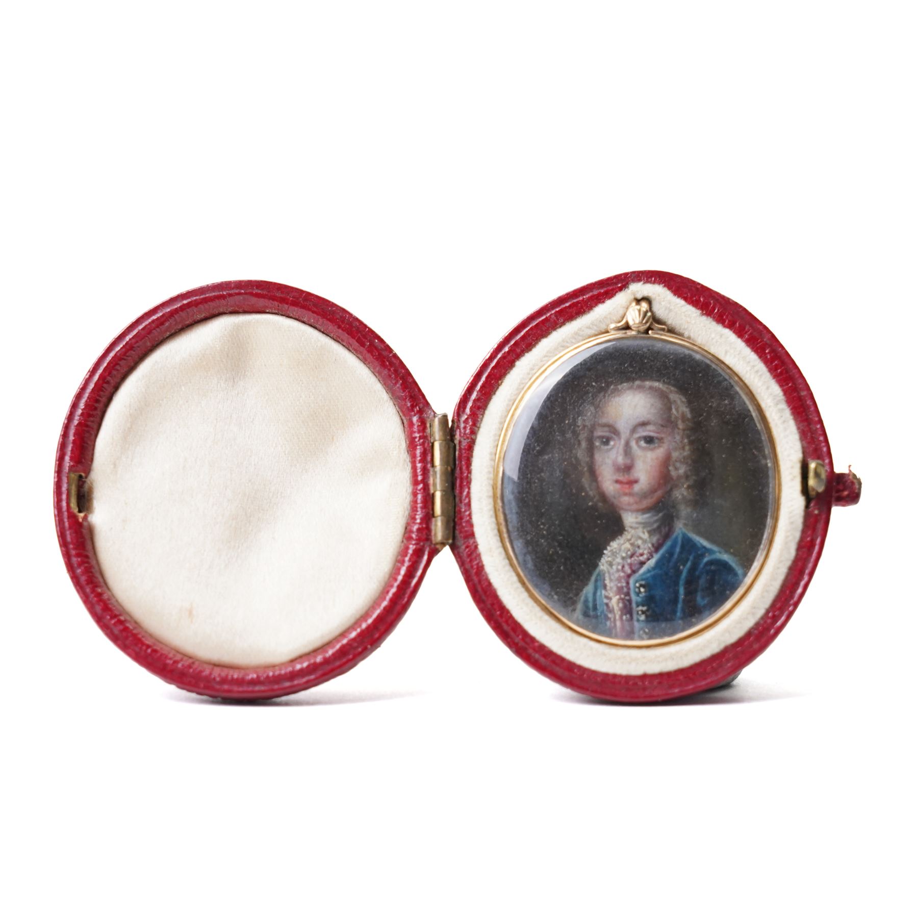 Jacobite interest - Continental School (Mid-18th century): Portrait Miniature Traditionally Identified as Prince Charles Edward Stuart (Bonnie Prince Charlie) depicted wearing a blue velvet coat and lace stock, watercolour on ivory, under convex glass within a gold pendant mount 3cm x 2.5cm, within Moroccan leather fitted case 
This item has been registered for sale under Section 10 of the APHA Ivory Act.
