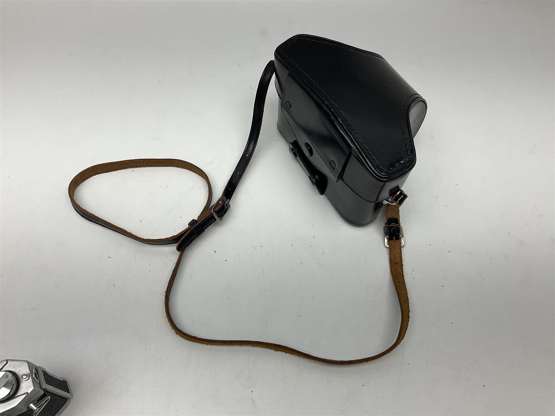 Petri Flex 7 camera body, serial no. 555698, with Perti C.C 1:1.8 f=55mm' lens, serial no. 78253, together with Petri Flex V2 camera body, serial no. 364427, with 'Petti C.C. 1:2 f=55mm' lens, serial no. 137076, in ever ready case