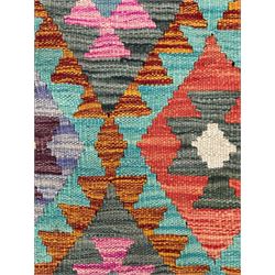 Tibetan-design handwoven rug, deep red field with three central medallions in yellow and blue, traditional yellow key border, white fringes on both ends