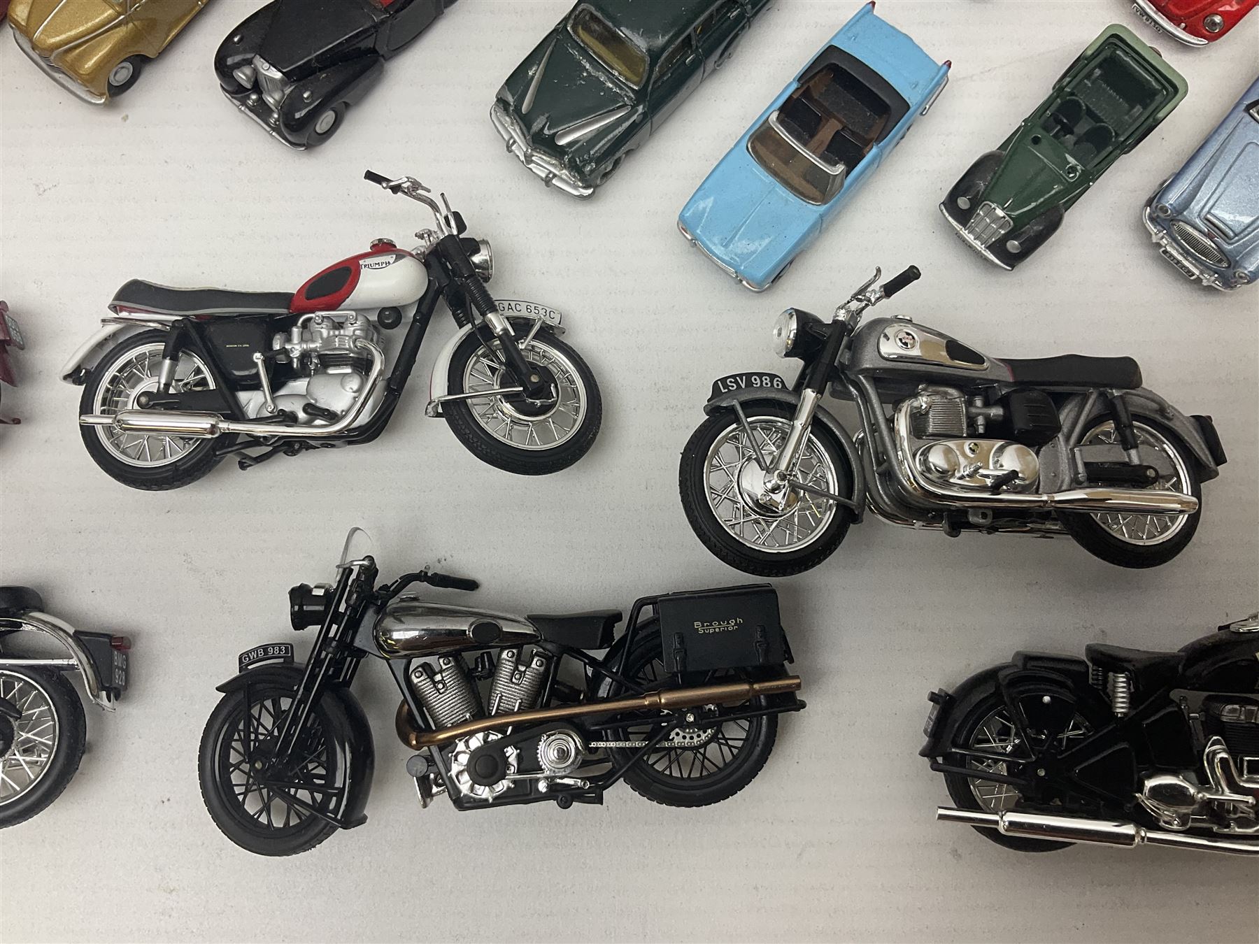 Over forty 1:76 scale die-cast models of cars and commercial vehicles; some boxed; and eight small scale models of motorcycles; all unboxed