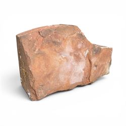 Pair of 19th century hewn and carved stone wall ends, the facias carved as shaped faux fielded panels