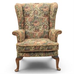 Parker Knoll - pair of mid-20th century wing back armchairs, upholstered in tapestry fabric, raised on cabriole legs