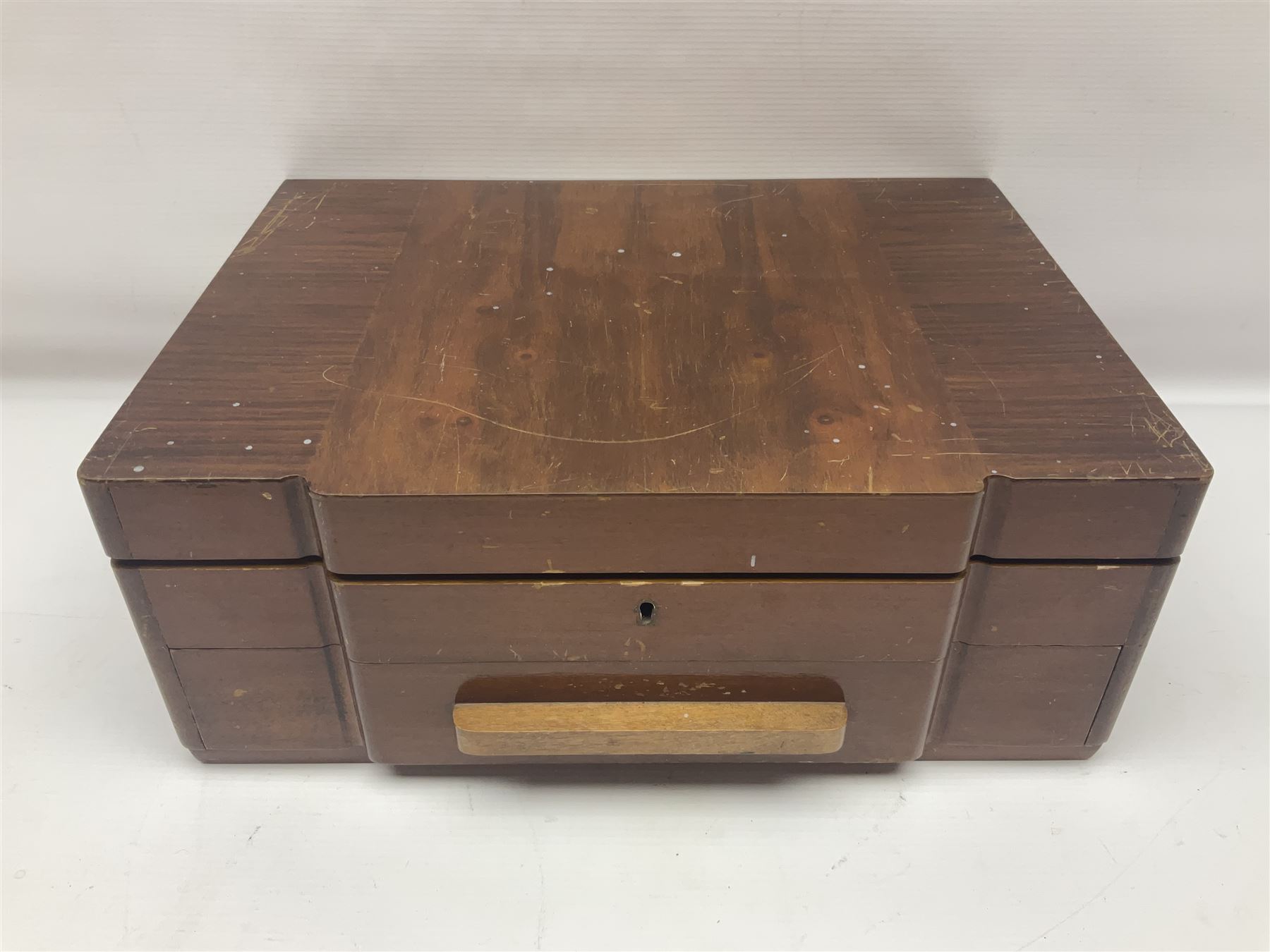 Art Deco canteen of silver plated cutlery for twelve place settings, including table and dessert knives with ivorine handles, retailed by Harrods Ltd, contained within a wooden case, with drawer to base, canteen case H15.5cm