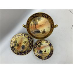 Noritake tea service for four, decorated with desert camel scene with blue border and gilding, comprising four teacups and saucers, four side plates, lidded sucrier, teapot and jug, together with twin handled pedestal bowl etc (19 pcs) 