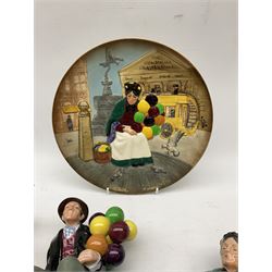 Three Royal Doulton figures, comprising 'The Balloon Seller' HN1315 together with matching plate, 'Biddy Pennyfarthing' HN1843, 'The Balloon Man' HN1954 (4)
