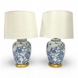 Pair of Chinese table lamps of baluster form, each decorated with landscape scene, raised upon gilt circular base, including shade H63cm