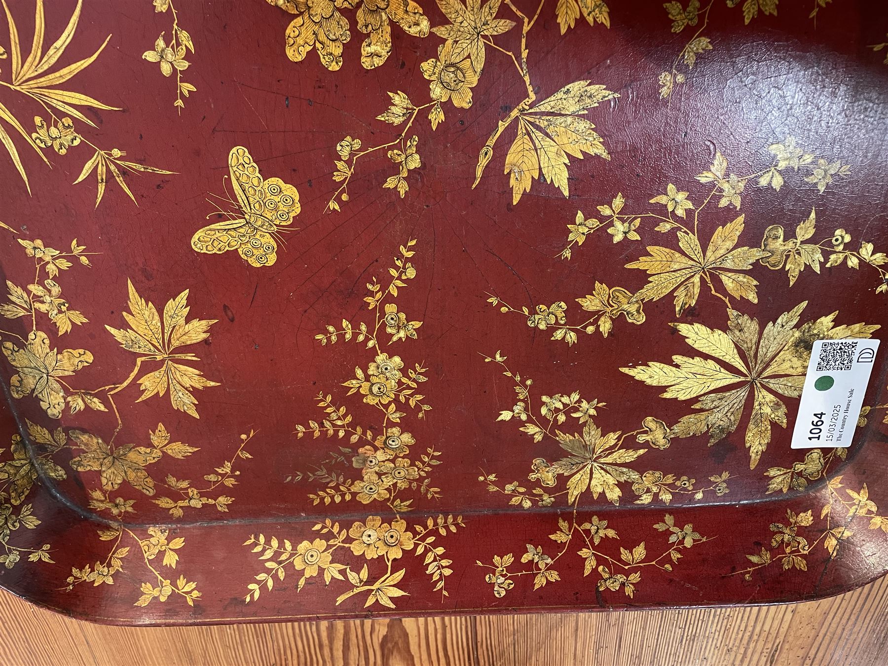 Early 19th century red lacquered papier-mâché tray by Clay of King Street Covent Garden, of rounded rectangular form, painted in gilt with large foliate sprays and butterflies, impressed verso CLAY KING ST COVENT GARDEN, W66.5cm D48.5cm