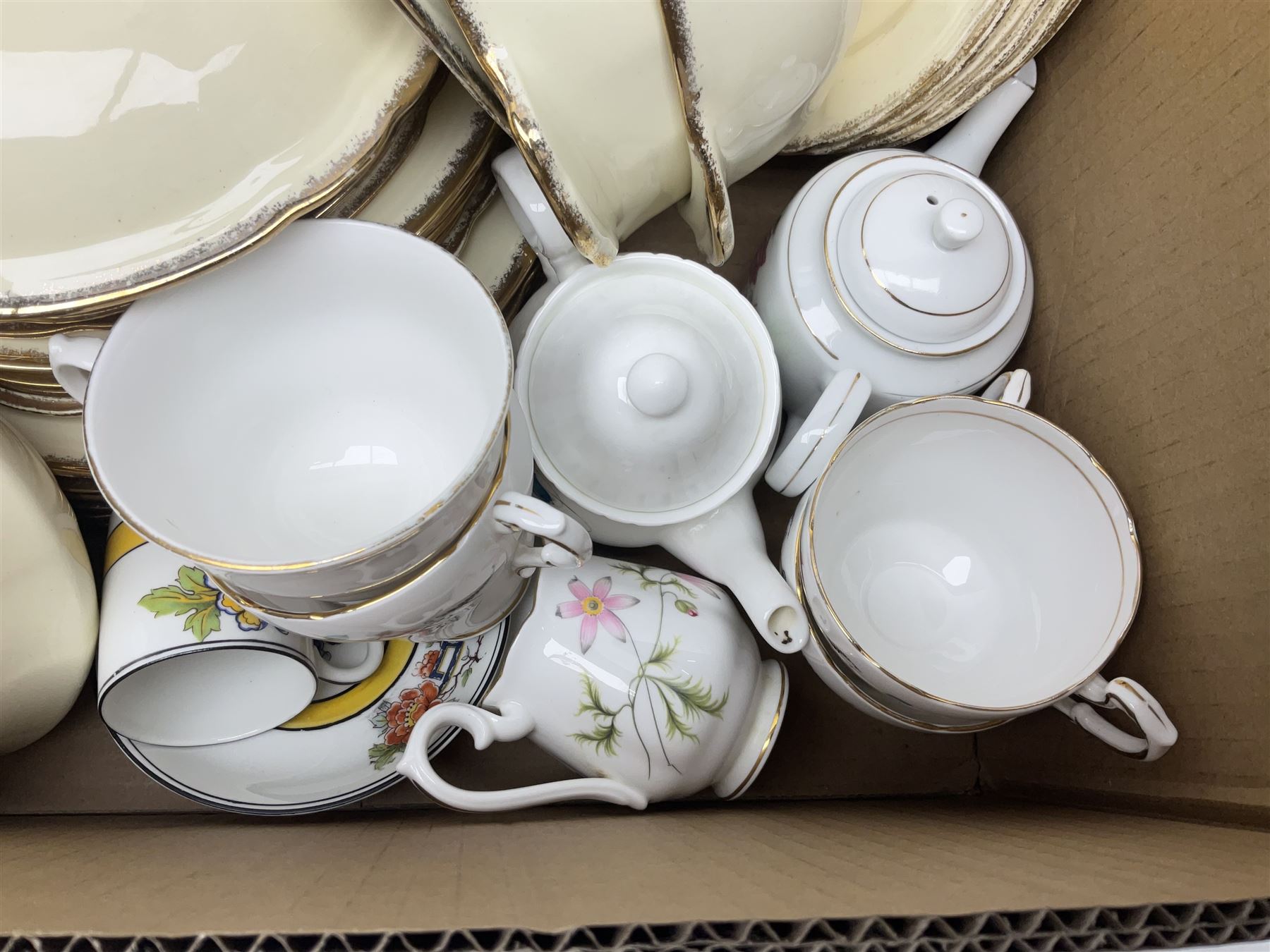 Royal Albert Masquerade pattern tea service for six, together with Royal Albert Dogwood pattern teacup and saucer and Alfred Meakin tea and dinner wares decorated with gilt on cream ground to include lidded tureens and oval serving plates etc in two boxes