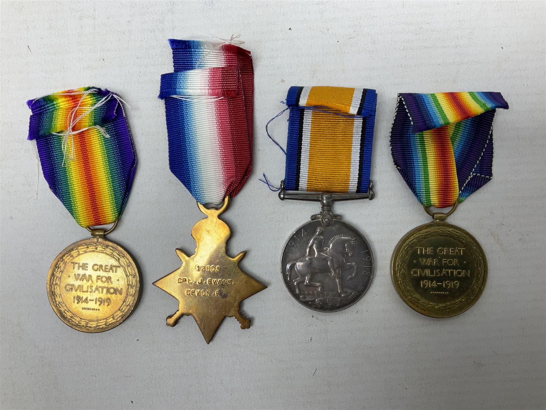 Two WW1 pairs of medals comprising British War Medal and Victory Medal awarded to 24506 Pte. A.E. Warland L.N. Lan. R.; and 1914-15 Star and Victory Medal to 12803 Cpl. J. Evans Devon R.; all with ribbons (4)