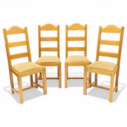 Late 20th century set of four light oak dining chairs, with green and red upholstery, on s...