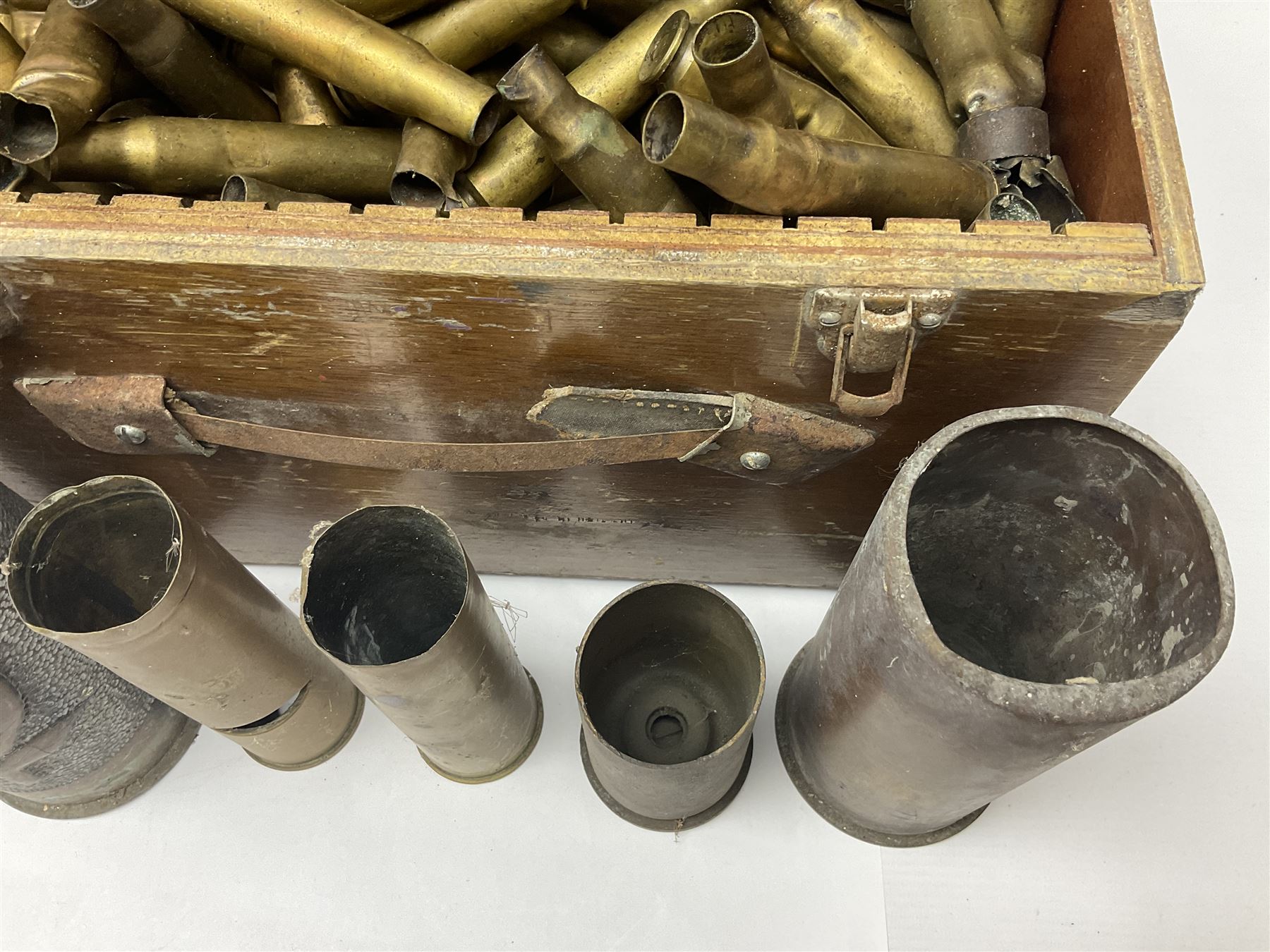 Large collection of shell and bullet casings, including a trench art example, together with a metal cartage case and wooden case