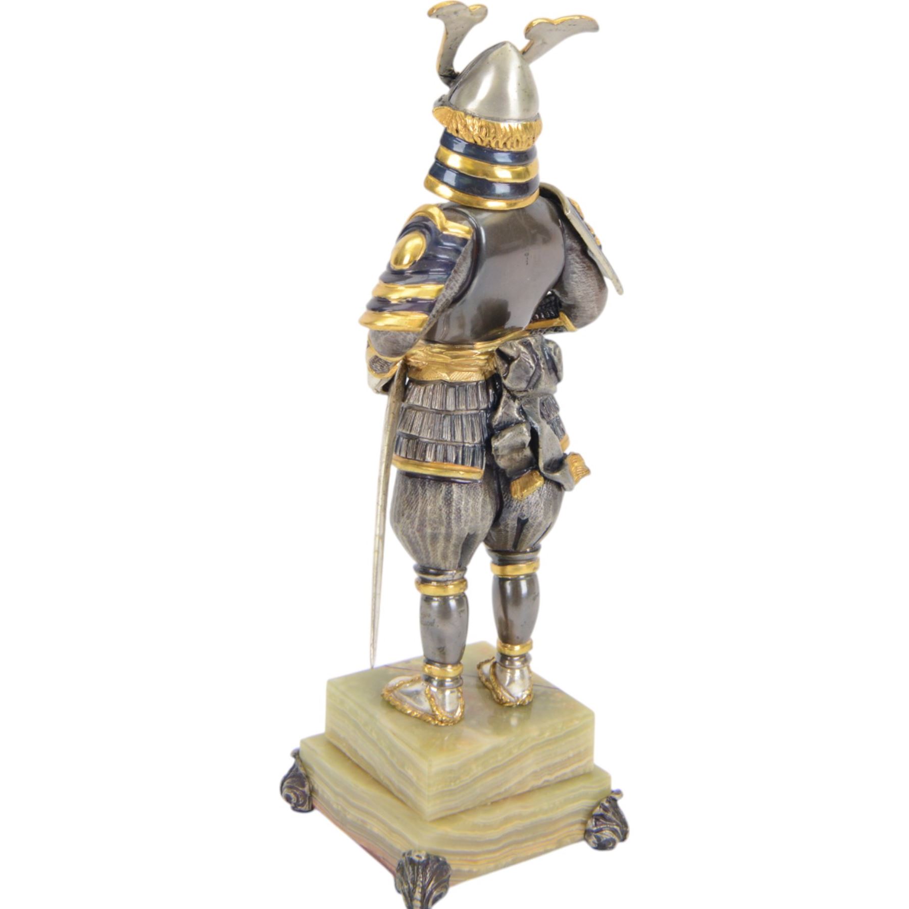 Italian limited edition silvered and gilt bronze figure of a Samurai warrior, with sword and flag, signed Giuseppe Vasari, no. 11/400,  upon an green stepped onyx base H25cm