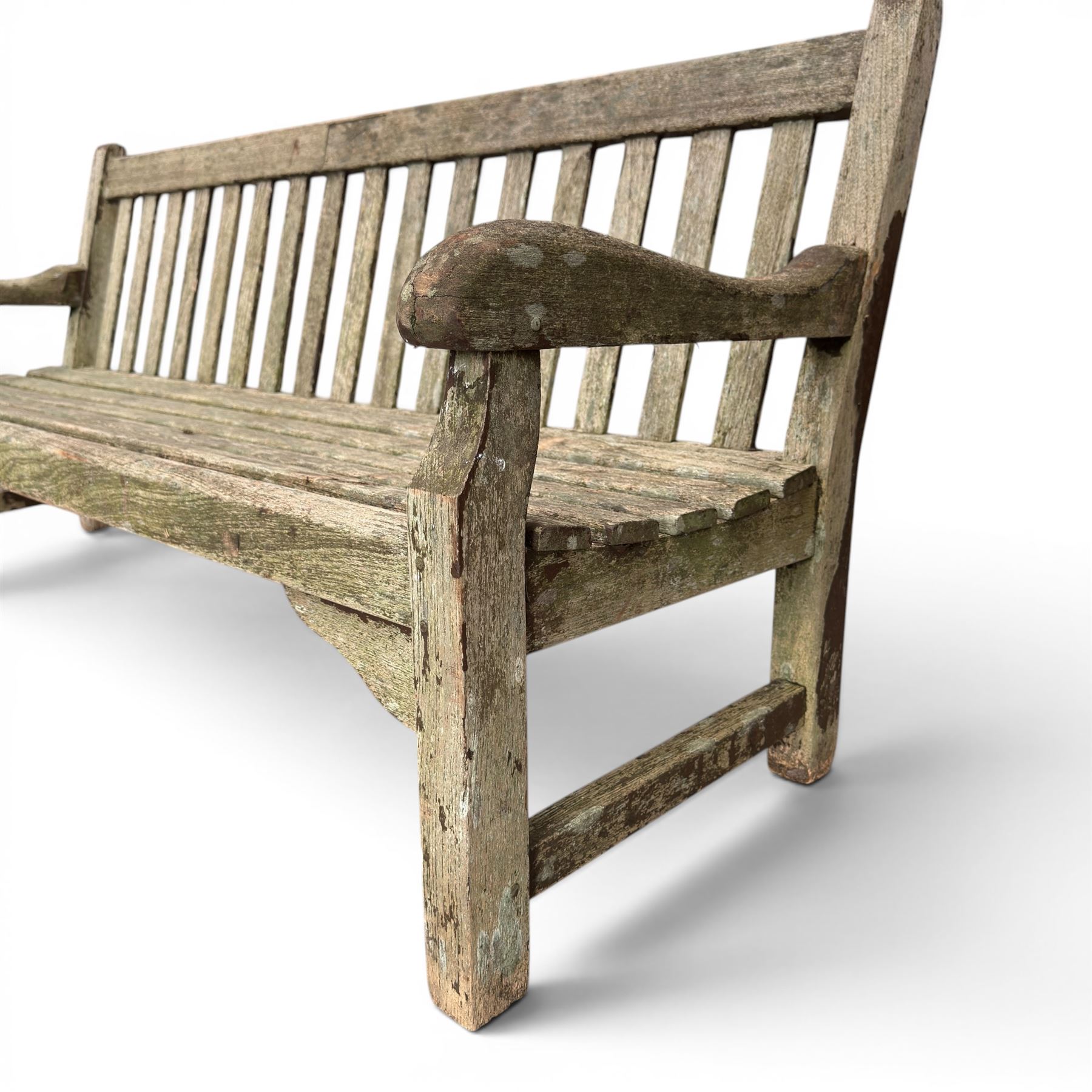 Teak garden bench with slatted back and seat raised on square supports