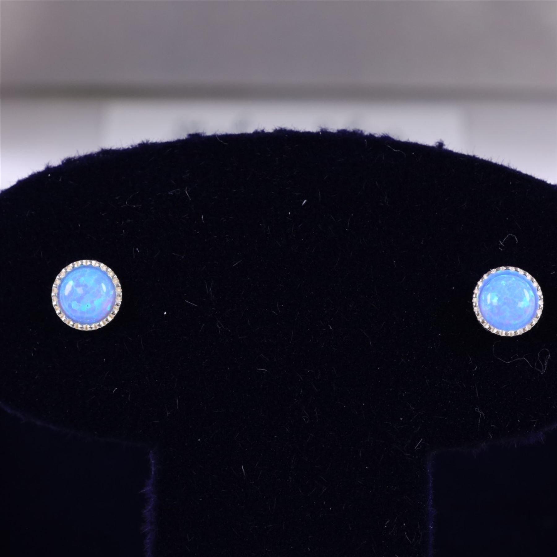 Pair of silver opal stud earrings, boxed