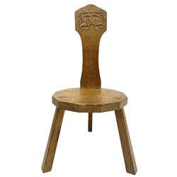 'Gnomeman' adzed oak hall chair, the shaped back relief carved with dragons, dodecagon seat, two splayed supports, by Thomas Whittaker of Littlebeck