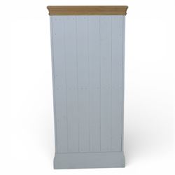 Modern narrow chest of five drawers in white finish with oak moulded top, with metal cup handles raised on a moulded plinth base