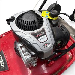 Cobra-  575ex petrol hover mower, with Briggs & Stratton engine, wheeled transport frame and red deck.