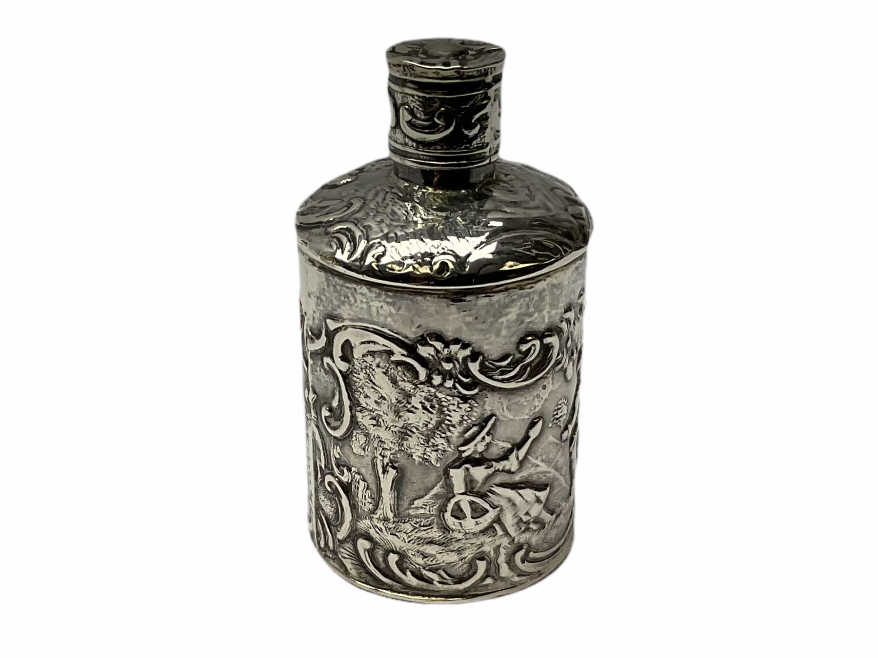 Cut glass perfume bottle of bellied form, the silver mounted cover with turquoise guilloche enamel top, hallmarked Henry Perkins & Sons, London 1927, together with a cut glass perfume bottle with silver mounted and yellow guilloche enamel lid, hallmarked Albert Carter, Birmingham 1950, Continental silver perfume bottle, of barrel form with embossed figural detail, stamped 930, scent bottle of bellied form with white metal foliate pierced overlay, amethyst glass scent bottle of flask form with foliate embossed white metal cover and suspension ring and chain, and three further examples, including one of ovoid form with painted decoration and silver cover, hallmarked for Birmingham.