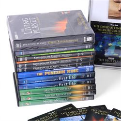 David Attenborough memorabilia, including framed montage of a Sunday Times Magazine cover and two DVD sleeves, one signed, books including first editions, DVDs and Audio CDs