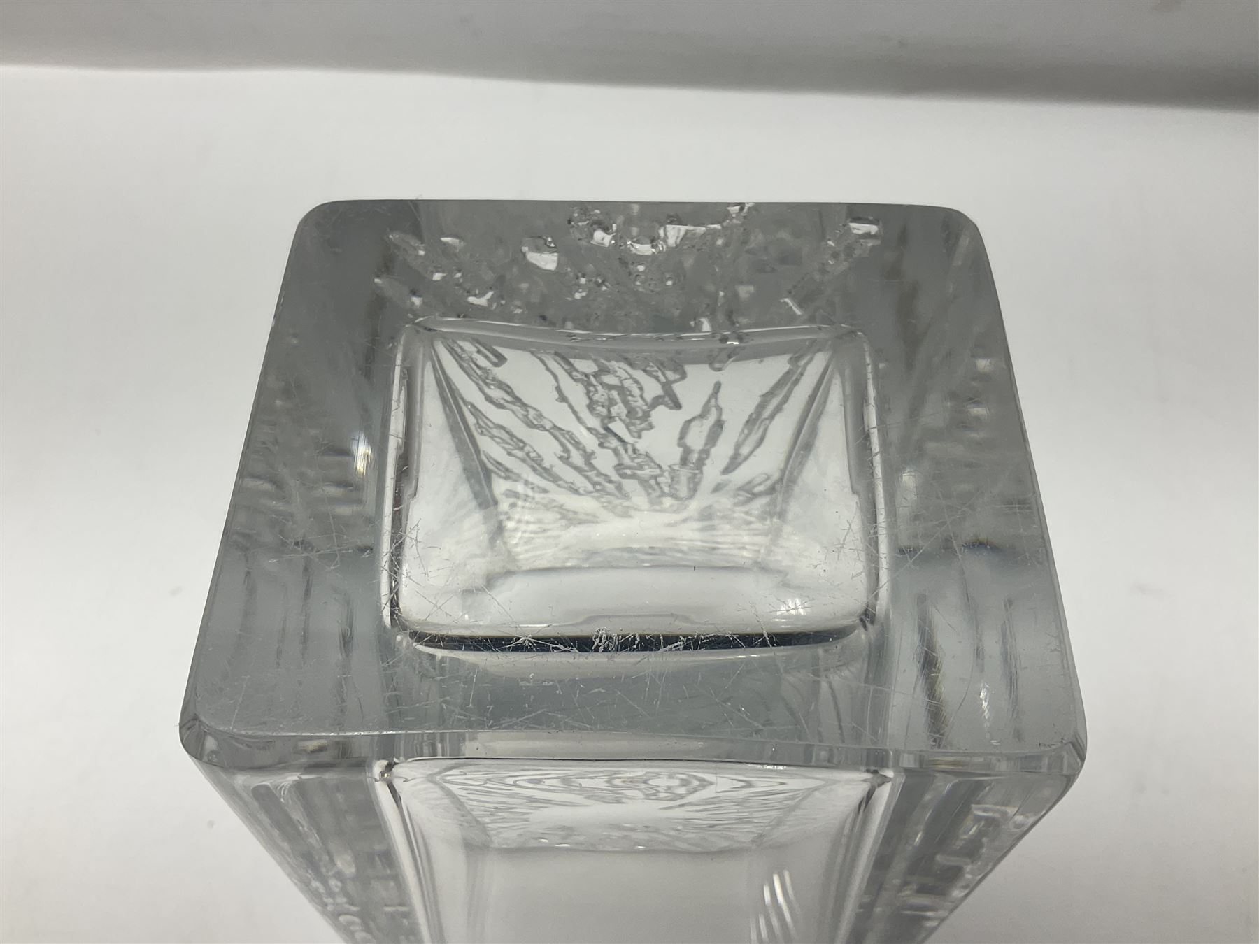 Daum clear crystal glass vase of square sleeve form decorated with stylised sunburst motif, engraved signature to the reverse H25cm