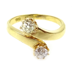  Gold two stone old cut diamond cross-over ring stamped 18ct  