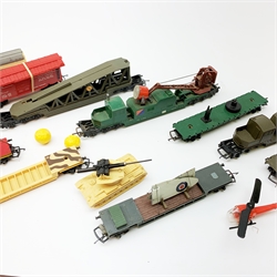 Tri-ang/Hornby '00' gauge - Battle Space North British 0-4-0 Diesel Shunter locomotive in red; Assault Tank Transporter; 4-Rocket Launcher; RAMC Ambulance car; Helicopter car; Tank Recovery car; Anti-Aircraft Searchlight wagon; two Plane Transporter cars; Plane Launching car; and two Exploding cars (one red) with instructions, all unboxed, (12)