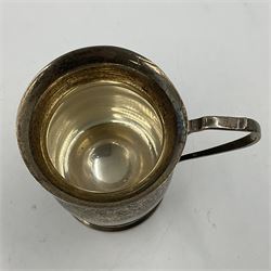 Modern silver christening mug, of waisted cylindrical form, with angular handle and upon stepped circular foot, hallmarked W I Broadway & Co, Birmingham 1978, H8.7cm