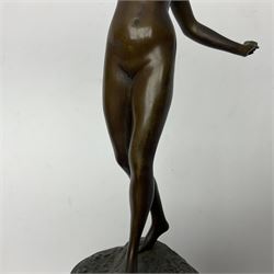 Bronze figure modelled as a nude woman with one arm raised a crescent moon upon her forehead, raised upon a circular stepped plinth, H36cm