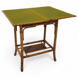 Late Victorian bamboo and lacquered card table, the top decorated with birds and floral sprays, hinged to reveal a baize playing surface, on bamboo effect legs with lacquered undertier