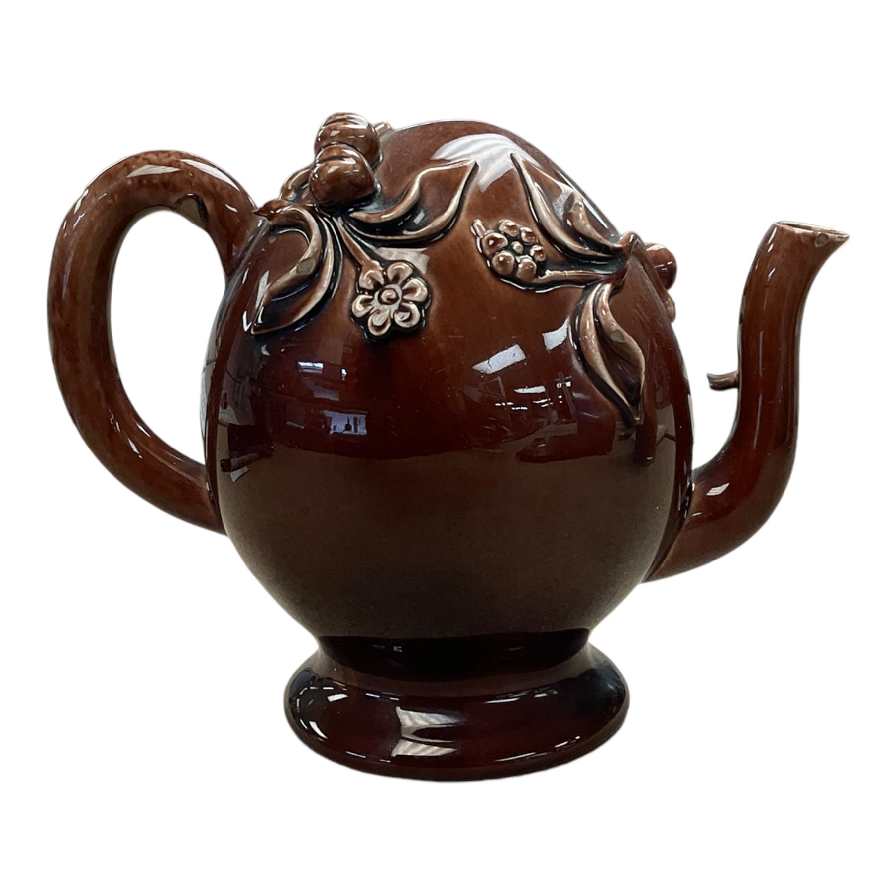 Brameld Cadogan Pottery Teapot, decorated in a brown glaze and applied with trailing fruit and flowers, impressed mark beneath 