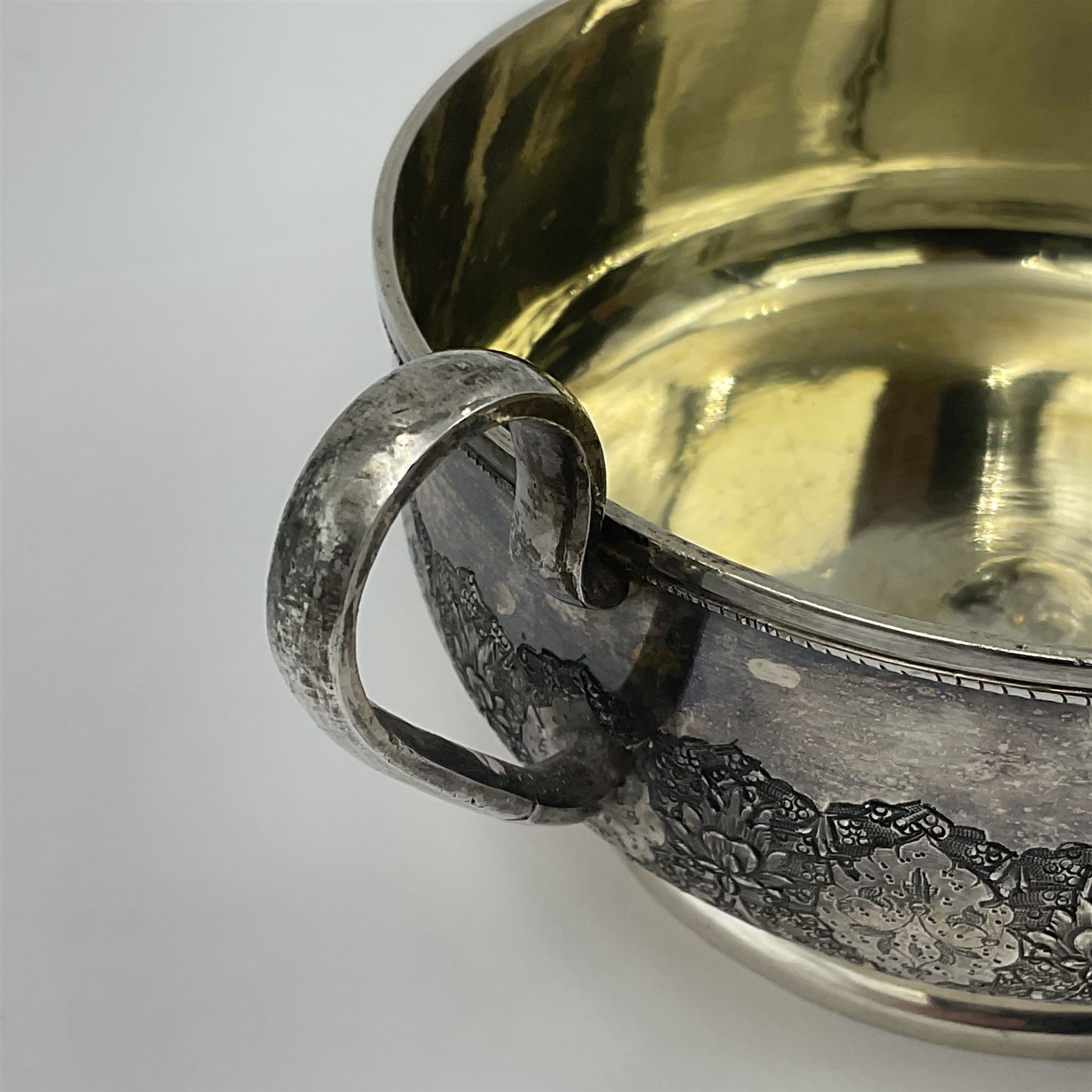 Early/mid 20th century Persian silver tea service, comprising circular serving tray, teapot, twin handled sucrier and cover, milk jug, five tea glasses with six silver holders, six tea spoons, and pair of sugar tongs, each profusely chased with foliate arabesque decoration, each bearing marks including 84 for 840 fineness, tray D40cm, teapot H16cm