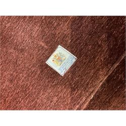 Knole type drop arm sofa with cushions in a traditional patterned upholstery,