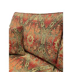 Duresta - 'Beaminster' grande two-seat sofa, traditional shape with rolled arms, upholstered in 'Althorp' russet and stone floral pattern fabric, on turned feet with brass castors
