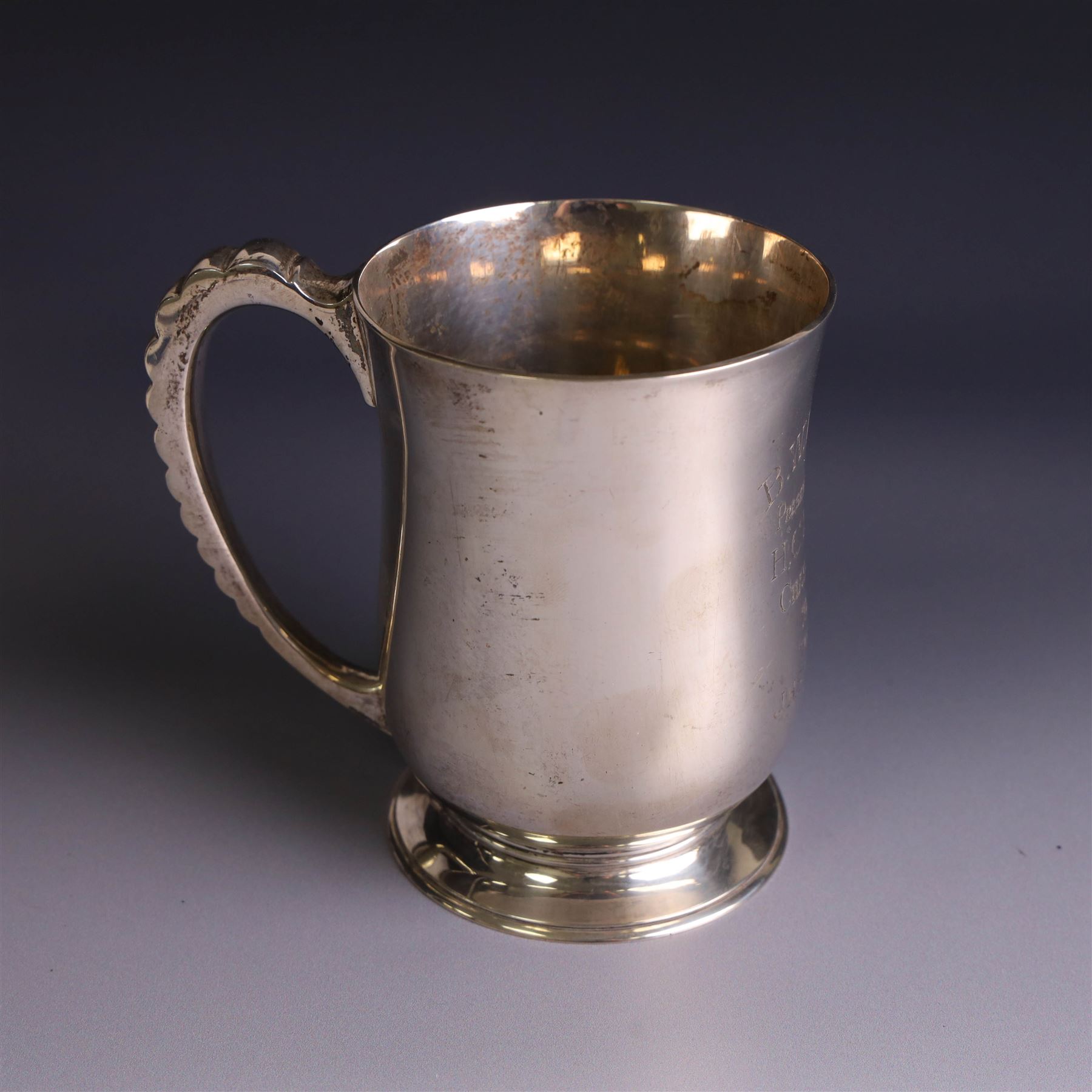 1930s silver tankard, of typical bellied form upon a circular base with ribbed handle, the body with presentation engraving, hallmarked Mappin & Webb Ltd, Sheffield 1937, H12cm