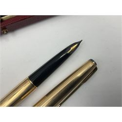 Three rolled gold Parker fountain pens, comprising an example with a gold nib marked 14K 585 and barrel with a shell stamp, a Parker 61 fountain pen with inset gold arrow to the nib, and another similar, all with striated decoration and arrow clips to the caps, L13cm, one with box