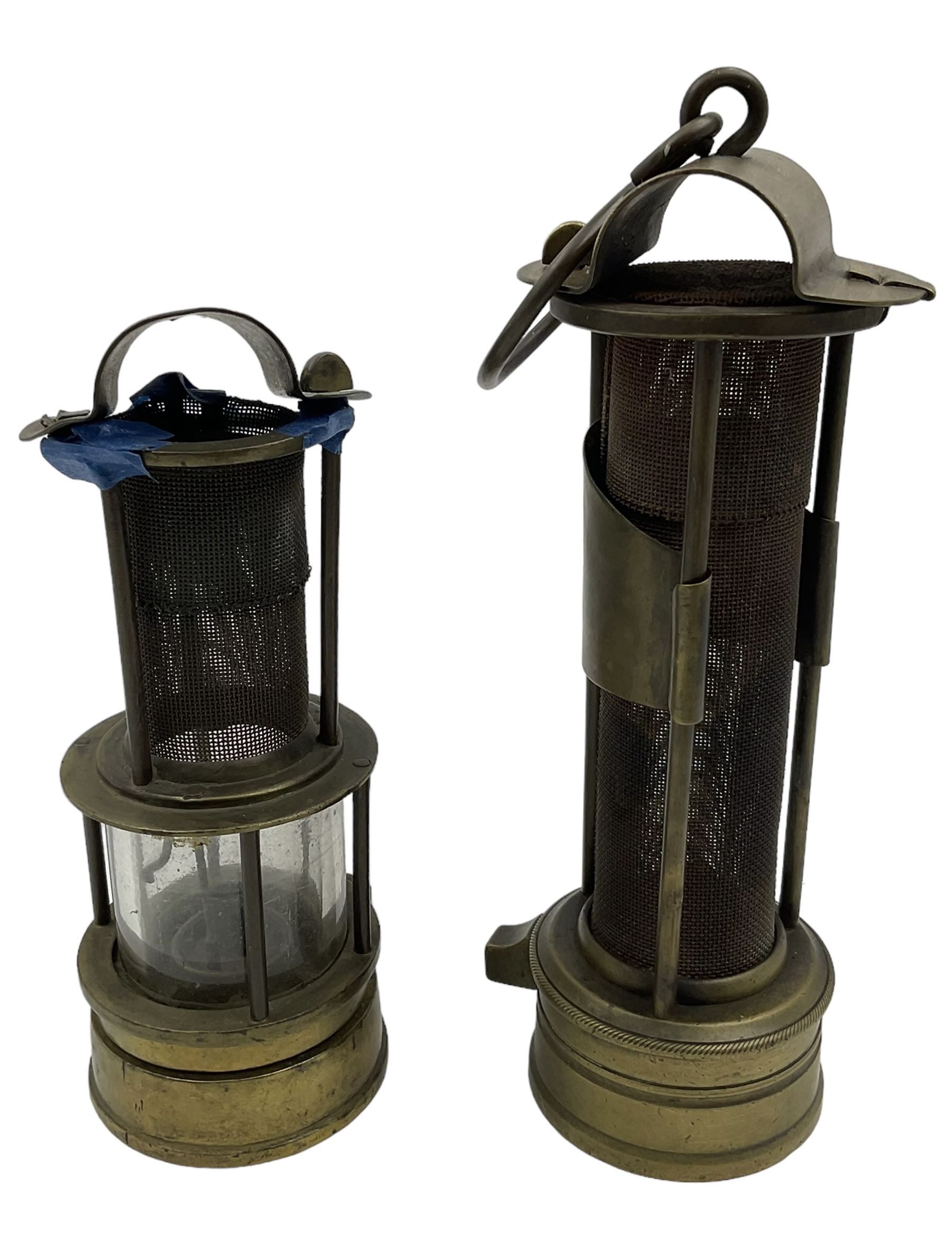Two mining lamps, including wire mesh three bar example and a wire mess and glass example 