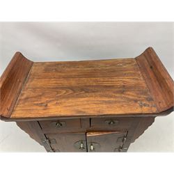 Chinese table top cabinet of altar form, fitted with pair of hinged doors opening to reveal shelved interior below two small drawers, with brass hinges and fittings, H43cm W50cm D25cm