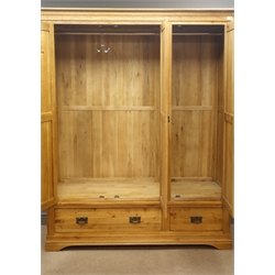  Light oak triple wardrobe, projecting cornice, three panelled doors enclosing fitted interior above one long and one short drawer, shaped plinth base, W156cm, H195cm, D63cm  
