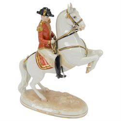 Royal Vienna Augarten figurine, modelled a Spanish Riding School rider upon rearing horse, with Trab-Spanische Reitschule Hofburg Wien in gilt to the base, H30cm