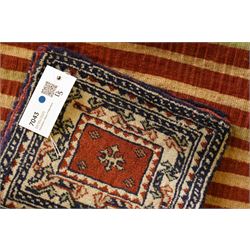 Persian tribal khorjin (saddlebag face), repeating gul motifs on a terracotta background, within cream and navy stepped borders, Top flap double-sided panel