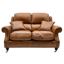 Parker Knoll - two seat traditional shape sofa, upholstered in tan leather